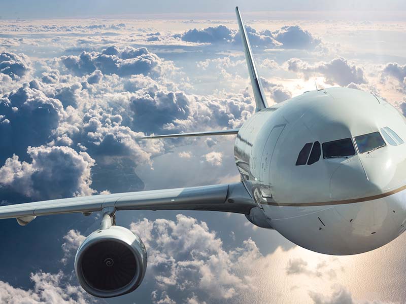 Close up of an airplane in the sky