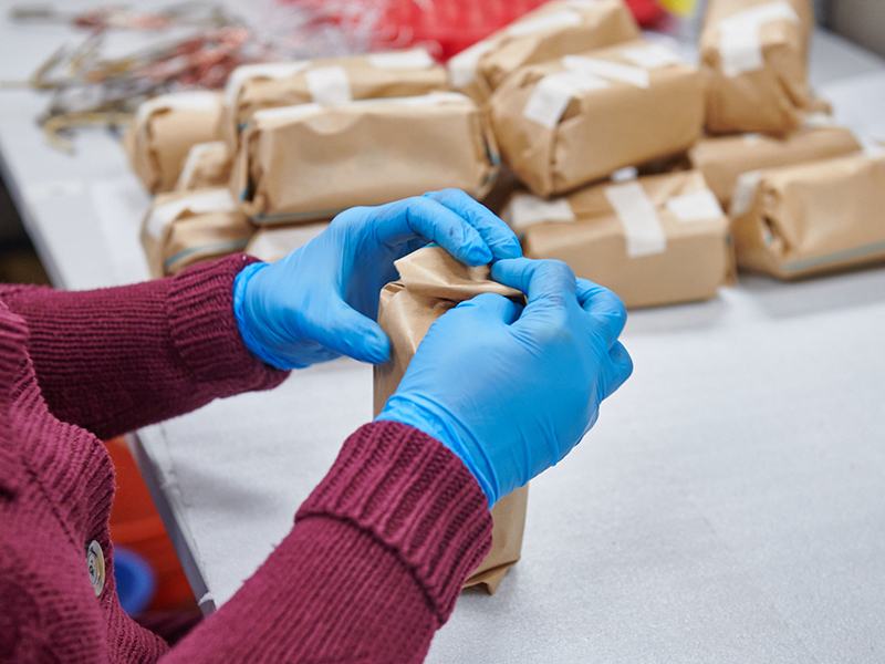 Items being wrapped in brown paper